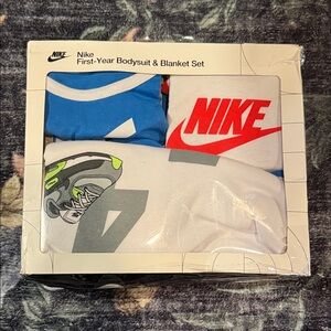 NWT/NIB Nike 4 piece Blue and White Bodysuit & Blanket Set.
